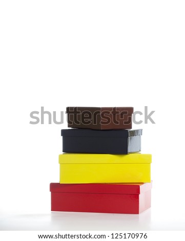 Four multi-colored boxes isolated on white - part of a series of images with eight boxes stacked upon each other sequentially.