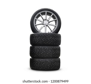 Four New Good-looking Snow Tires Isolated On The White Background. A Set Of Studded Winter Car Tires. A Set Of Wheels And Tyre Packages. Wheel Parts. Tire Service