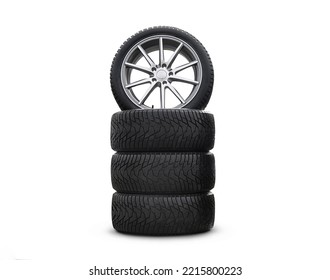 Four New Good-looking Snow Tires Isolated On The White Background. A Set Of Studded Winter Car Tires. A Set Of Wheels And Tires. Tire Service