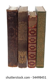 Four ornate antique books isolated on a white background