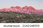 Four Peaks experiencing alpenglow on the desert of the outskirts of Phoenix, Arizona. A recent snow fall dumped on these mountains and quickly melted away. 