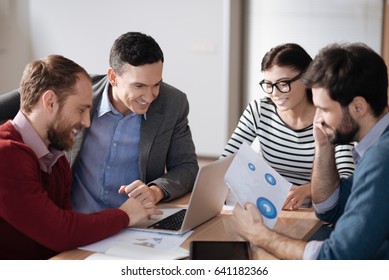 Four people from team spending break together - Shutterstock ID 641182366