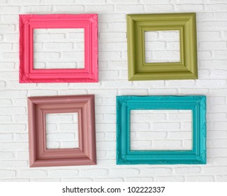 Four Photo Frames On The White Wall