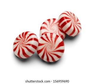 Four Pieces of Peppermint Candy With Swirls Isolated on White Background.