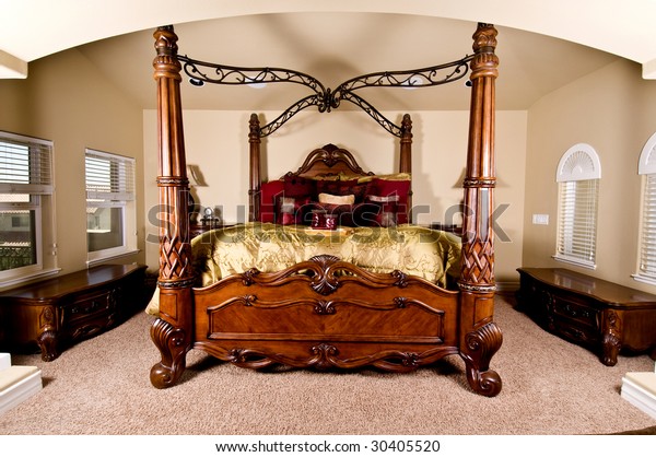 Four poster bed\
in a luxurious master\
bedroom