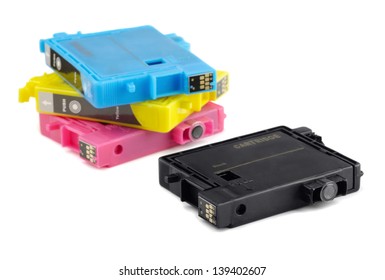 Four printer ink cartridges isolated on white