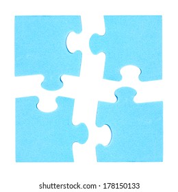 Four  Puzzle Pieces Combined Cooperation Concept. Isolated On White Background 