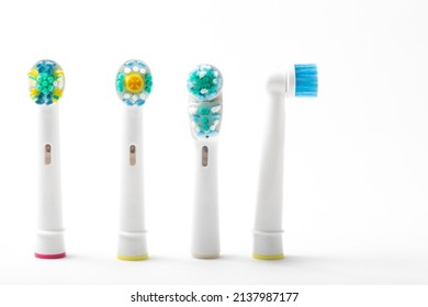 Four Replacement Electric Toothbrush Heads Stood Up One Facing To The Side Isolated From White Background No People Nobody