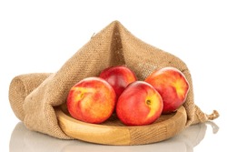 Four Ripe Nectarines On A Wooden Tray With A Jute Bag, Macro, Isolated On White Background.