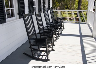 Four Rocking Chairs On Front Porch