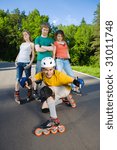 Four rollers at summer park