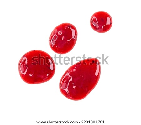Four round drops of red berry sauce or jam isolated on white background