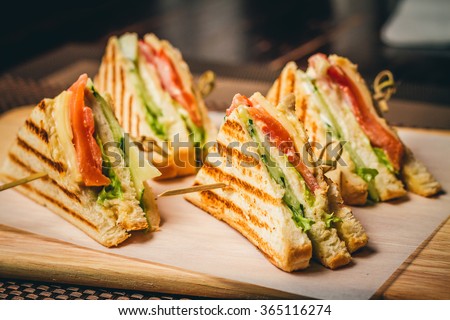 Four sandwiches on the board