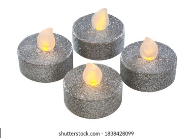 Four silver LED candles isolated against white background - Powered by Shutterstock