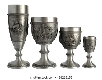 Four silver wine glasses and goblets with nautical bas-relief isolated on white background                                
