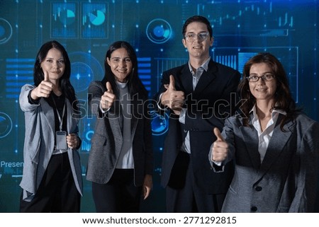 Four smiling professionals stand in front of a digital data background, giving a thumbs-up, symbolizing success, teamwork, and positive business outcomes.