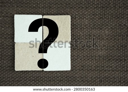 Four squares join with a question mark in the middle. big question mark symbols. the concept of a question or problem. Q and A. human resources concept