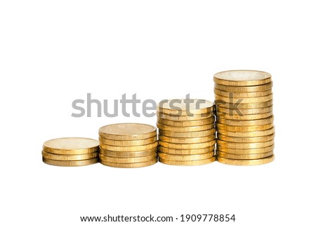 Four stacks of coins isolate on white background. Money growth concept. Banking, finance, currency.