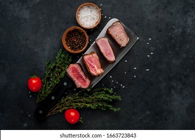 
Four Steaks On
Knife On A Stone Background. Four Types Of Meat Frying Rare, Medium, Medium Good, Well Done