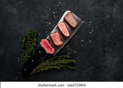 
Four Steaks On
Knife On A Stone Background. Four Types Of Meat Frying Rare, Medium, Medium Good, Well Done