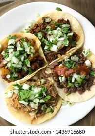 Four Street Tacos On White Plate