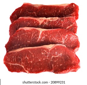 Four Striploin Steaks (also Known As Delmonico Steak, Kansas City Strip Steak, Shell Steak, New York Steak And Porterhouse Steak In Various Societies) On A White Background