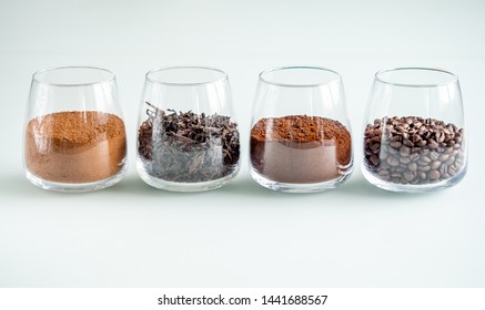 four transparent glasses with filling