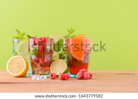 Similar – Infused water in bottles with drink straw and ingredients on white background, front view. Water Flavored with fruits, berries and herbs. Summer drinks. Healthy and clean detox beverages.