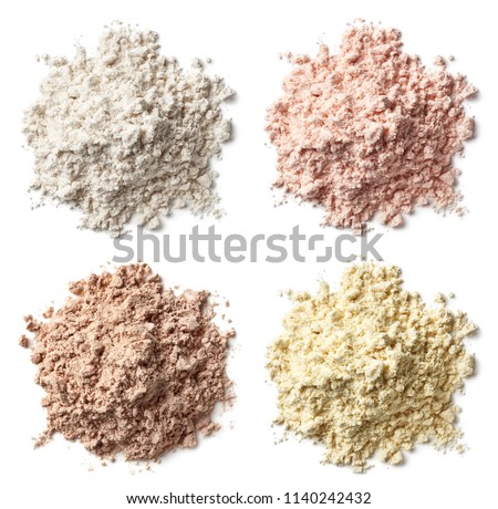 Four various heaps of protein powder (vanilla, strawberry, chocolate, banana) isolated on white background. Top view