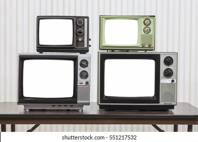 Four Vintage Televisions On Table With Cut Out Screens.