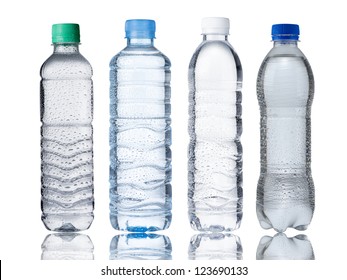 Four water bottles isolated on white background