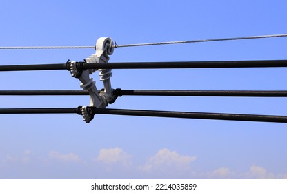 Four way metal power line spacer, Powerline separator, cable spacer and high voltage electric wire with blue sky background