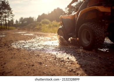 Four Wheeler In The Nature.Quad Bike In The Mountains In Mud