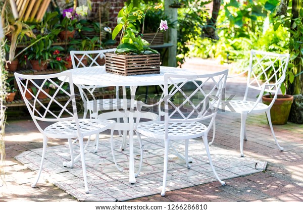 Four White Cast Iron Chairs Table Stock Photo Edit Now 1266286810
