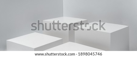Four white cubes platform on white background
