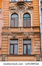 four windows on a facade of a residential house in the downtown of Saint Petersburg - Shutterstock ID 1291989544
