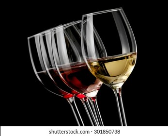 Four Wine Glasses With Wine On Black Background