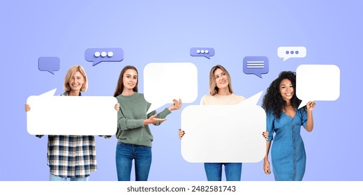 Four women holding blank signs, standing in a row with speech bubbles around them on a light blue background. Concept of communication and teamwork - Powered by Shutterstock