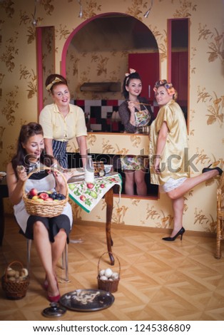 Four women in the kitchen talking and cooking. Concept of friendship, household. Retro style, vintage, pin-up.