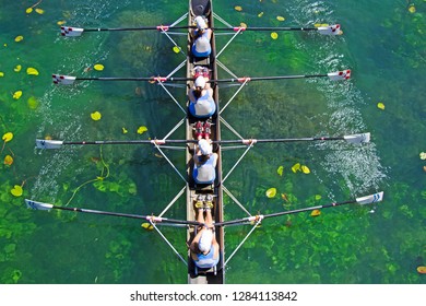 Four Womens Rowing Team On Blue Lake, Aerial View