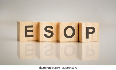 Four wooden cubes with letters Esop. Business marketing concept