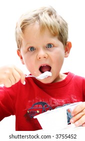 Four Year Old Boy Eating Yogurt.