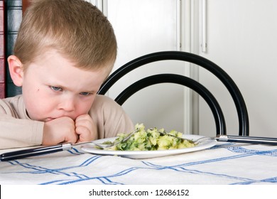 Four year old boy refusing to eat his dinner