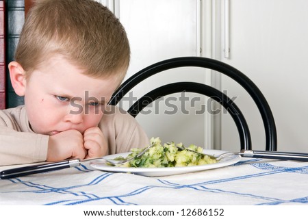 Four year old boy refusing to eat his dinner