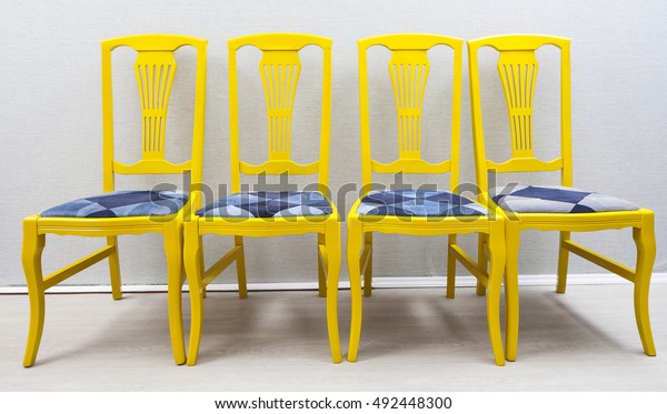 Four Yellow Wooden Chairs Denim Seat Stock Photo Edit Now 492448300