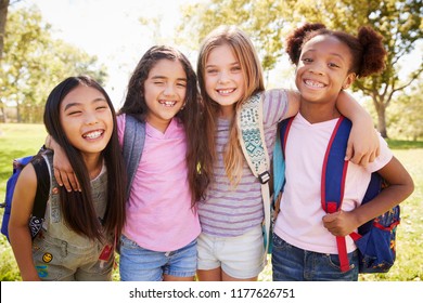 Four young smiling schoolgirls on a school trip - Shutterstock ID 1177626751
