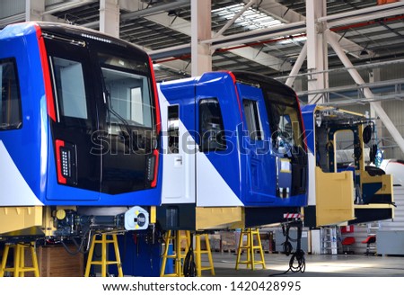 A four-car Stadler train produced by the Stadler Minsk rolling stock plant for the Minsk Metro. Inside of the rail car assembly plant for the production of European high speed trains.