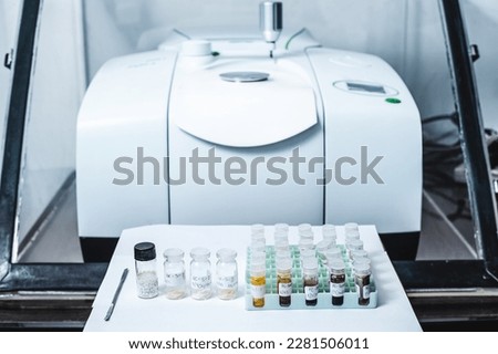 Fourier Transform Infrared Spectroscopy FTIR instrument and sample in vials for analysis. The FTIR instrument was used to identify the chemical identity of the drug or sample analysed.