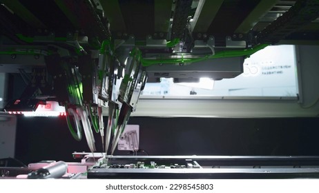 The fourth industrial revolution. Electronic circuit board production. Automated Circut Board machine Produces Printed digital electronic board. Electronics contract manufacturing. High-tech - Powered by Shutterstock