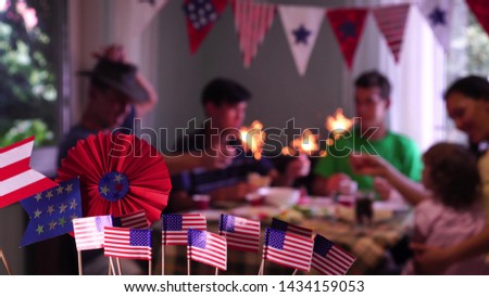 The Fourth of July Celebrations in the USA. Festive food and holiday. The happy American family is celebrating, talking and eating together